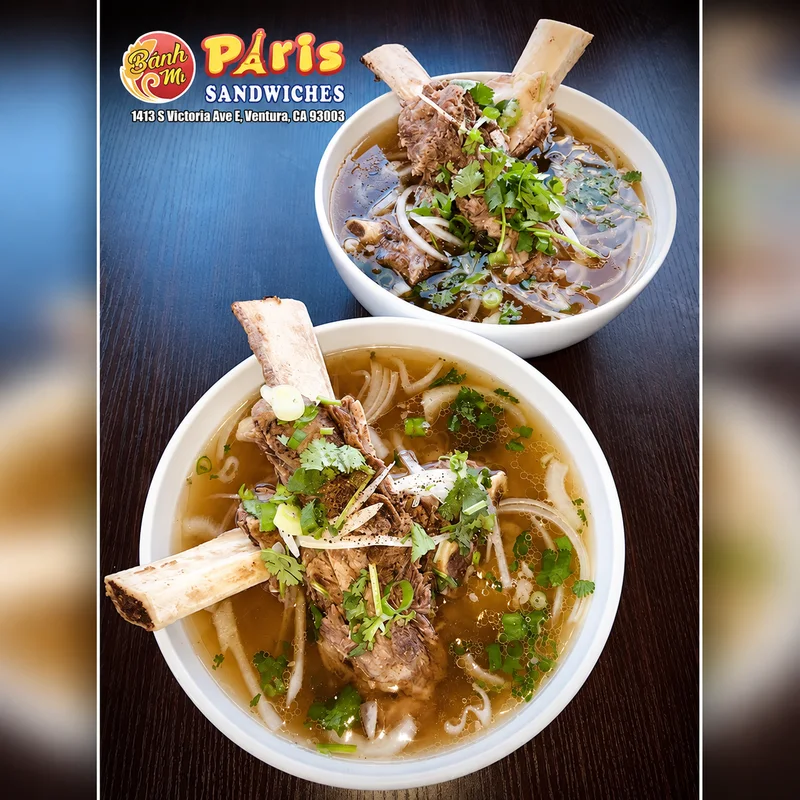 Two bowls of bone-in beef pho at Banh Mi Paris Sandwiches